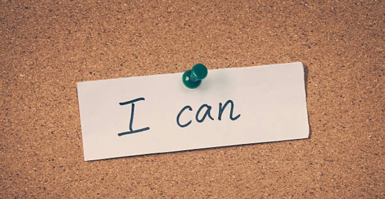 A note pinned to a corkboard reads "I can," symbolizing motivation and positive affirmation.